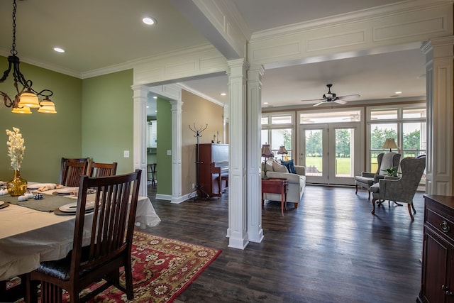 dining space featuring ornamental molding, ornate columns, ceiling fan, and dark hardwood / wood-style floors