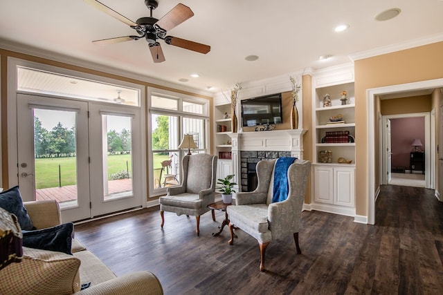 interior space featuring a wealth of natural light, crown molding, ceiling fan, and dark hardwood / wood-style flooring