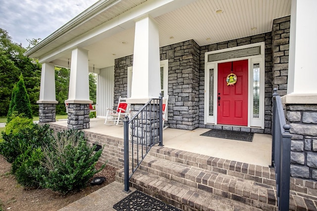 doorway to property featuring covered porch