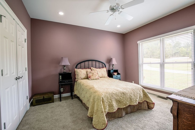 bedroom with carpet flooring, ceiling fan, and a closet