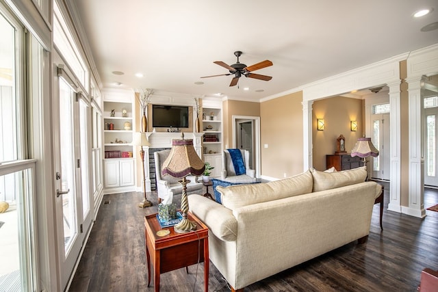 living room featuring plenty of natural light and dark hardwood / wood-style floors