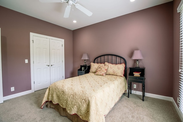 carpeted bedroom with a closet and ceiling fan