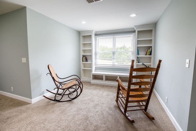 living area with carpet flooring