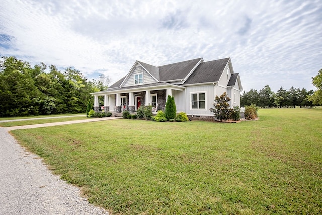 view of front of house with a porch and a front lawn