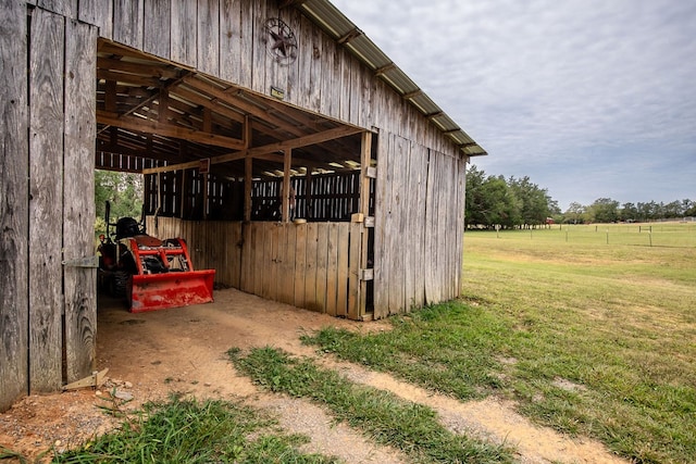 exterior space with an outbuilding and a rural view