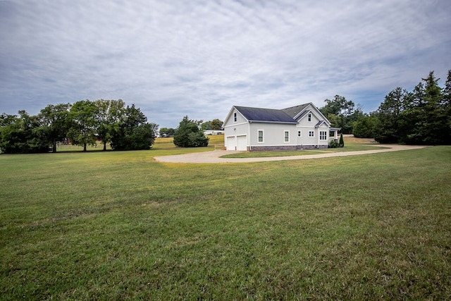 view of yard with a garage