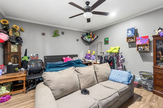 interior space with light wood-type flooring, ceiling fan, and ornamental molding