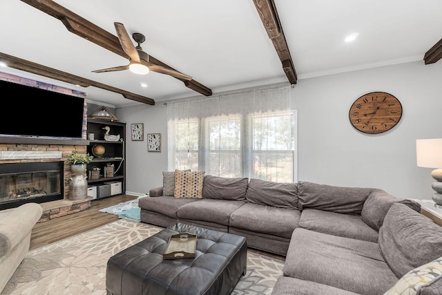 living room with beam ceiling, recessed lighting, a fireplace, wood finished floors, and a ceiling fan