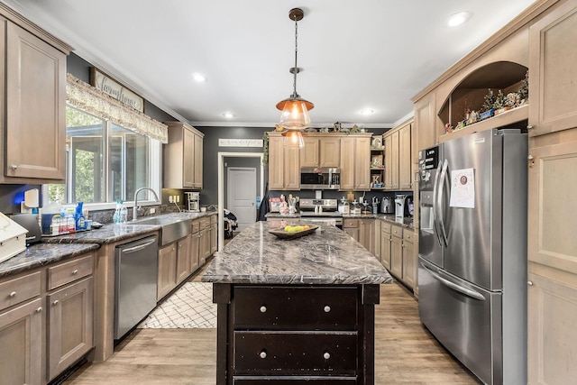kitchen with dark stone countertops, open shelves, a sink, appliances with stainless steel finishes, and light wood-type flooring