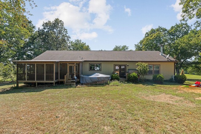 exterior space with a front yard and a sunroom