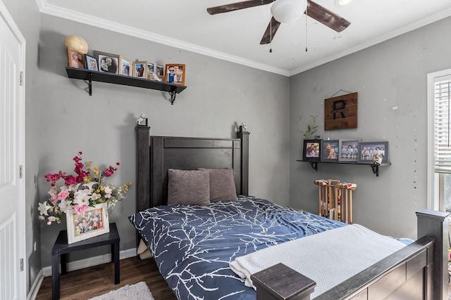 bedroom with ceiling fan, baseboards, wood finished floors, and ornamental molding