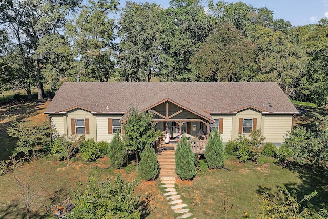 view of front of house featuring a wooden deck and stairs