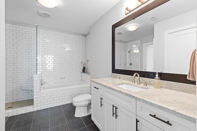 full bathroom featuring vanity, toilet, independent shower and bath, and tile patterned floors