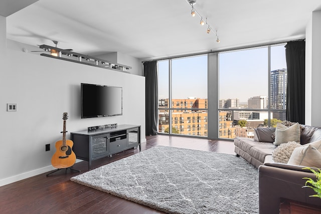 living room featuring a wall of windows, ceiling fan, a wealth of natural light, and dark hardwood / wood-style floors