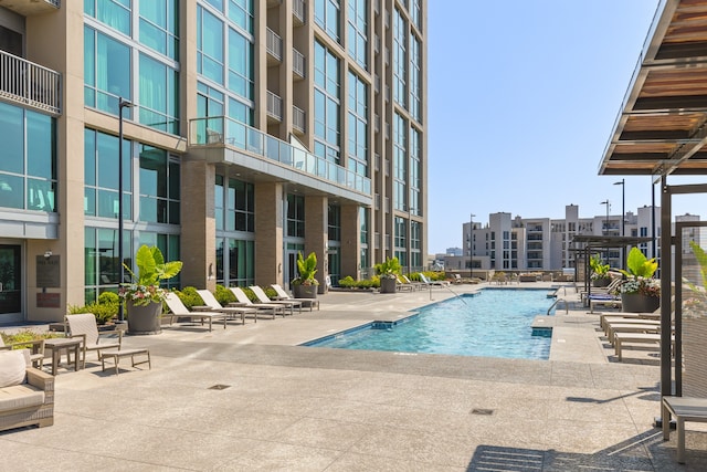 view of swimming pool with a patio area