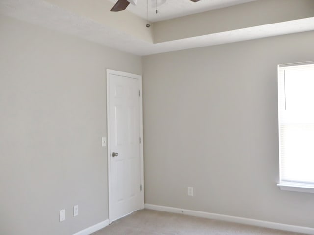 carpeted empty room with ceiling fan