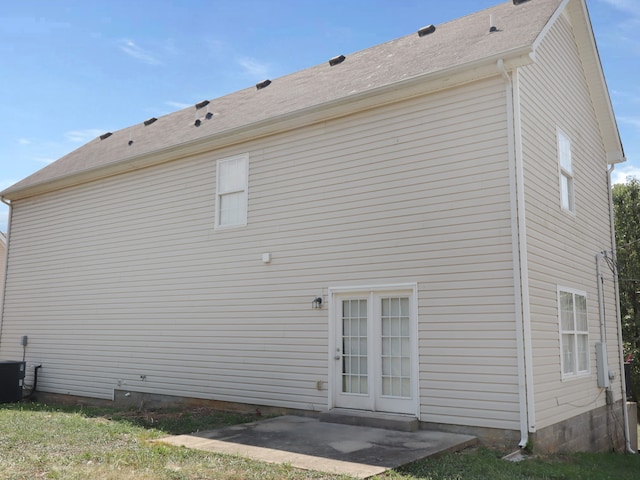 rear view of property featuring cooling unit and a patio