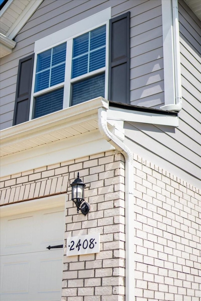 exterior details featuring brick siding