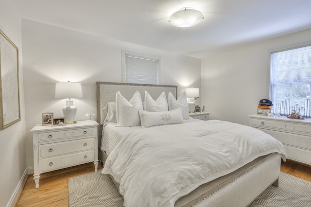 bedroom with light hardwood / wood-style flooring