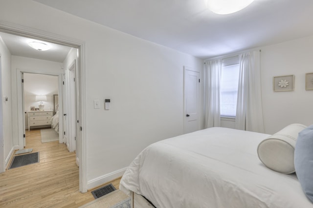 bedroom featuring light wood-type flooring