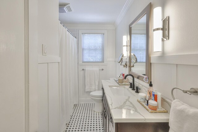 bathroom featuring crown molding, toilet, a shower with curtain, and vanity