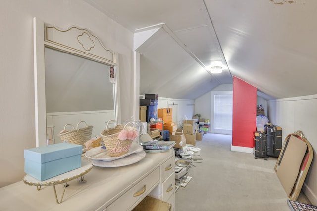 additional living space with lofted ceiling and carpet