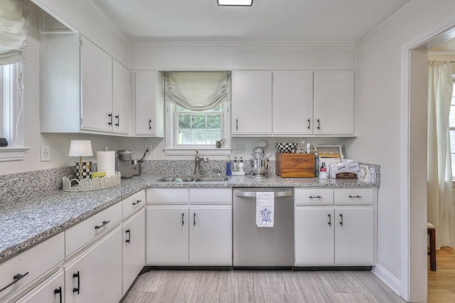 kitchen with light stone countertops, dishwasher, sink, white cabinetry, and light wood-type flooring