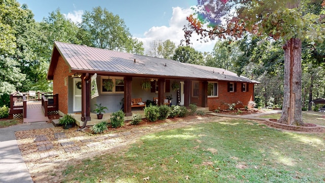 view of front of house with a porch and a front lawn