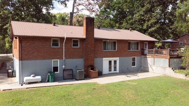 back of house with a lawn, cooling unit, french doors, a patio area, and a deck