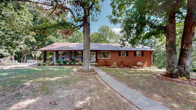 ranch-style house with a front lawn and a porch