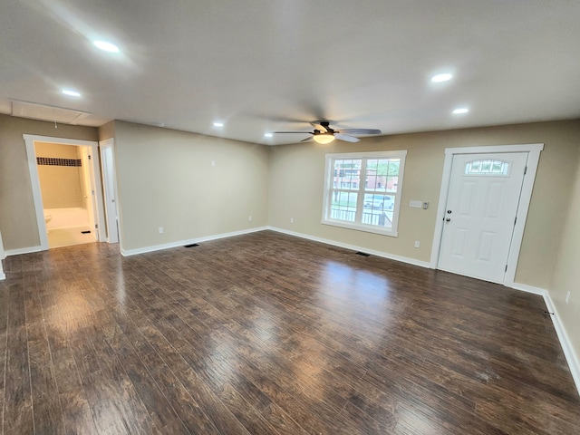 interior space with ceiling fan and dark wood-type flooring