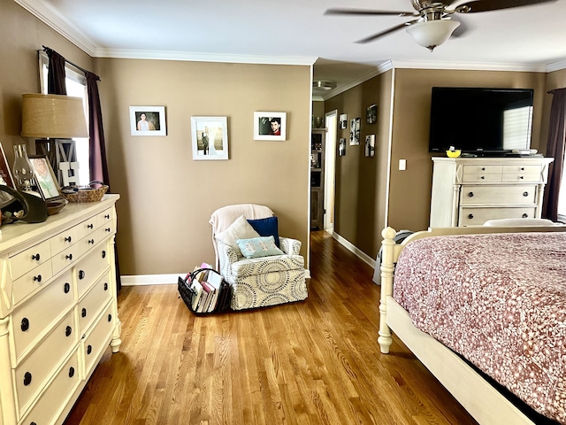 bedroom featuring ornamental molding, hardwood / wood-style flooring, and ceiling fan