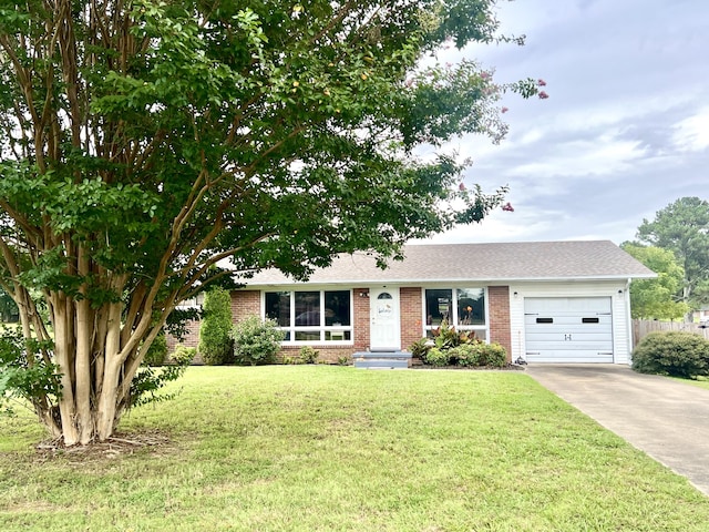 single story home with a front yard and a garage