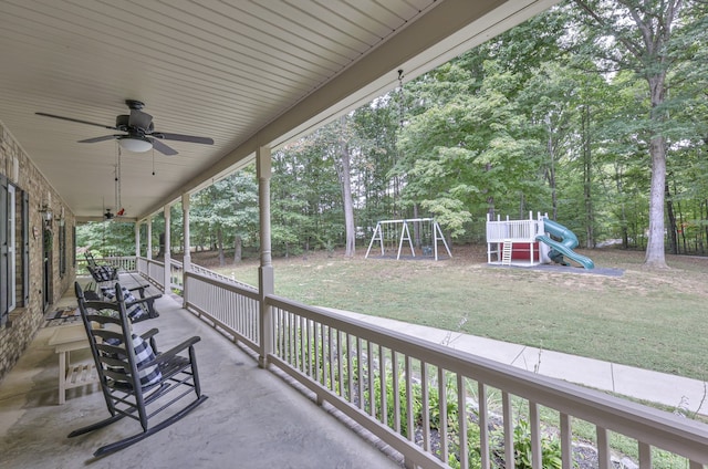 view of patio with a playground, a porch, and ceiling fan