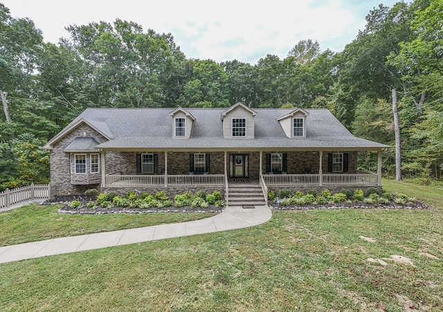 view of front facade featuring a front lawn and covered porch