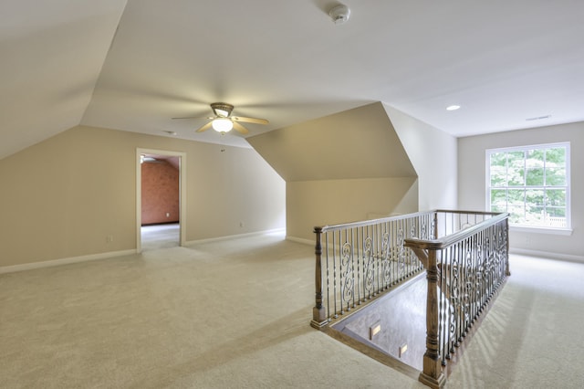 bonus room featuring ceiling fan, vaulted ceiling, and carpet floors