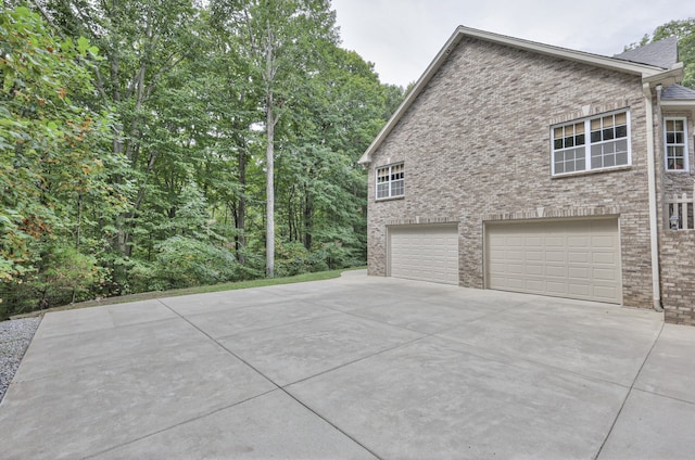 view of side of home with a garage