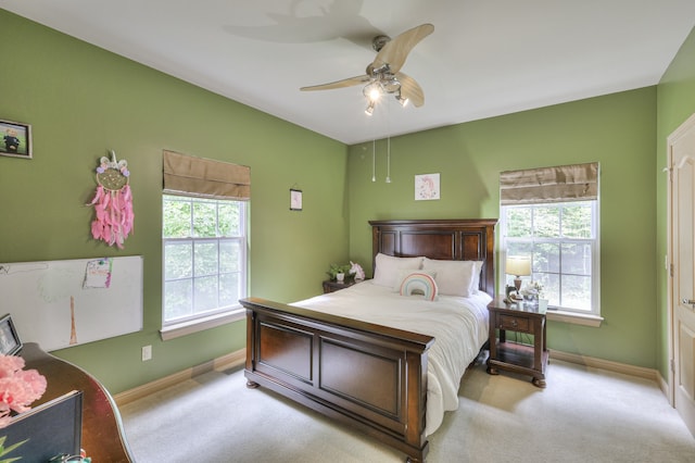 bedroom with ceiling fan and light carpet