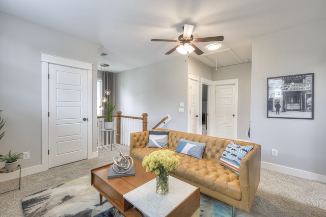 carpeted living room with ceiling fan