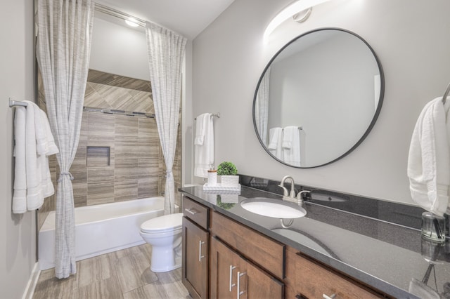 full bathroom featuring vanity, toilet, hardwood / wood-style floors, and shower / bath combo