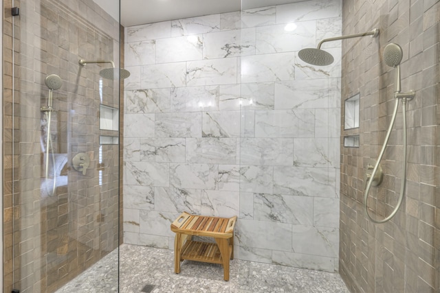 bathroom featuring a tile shower