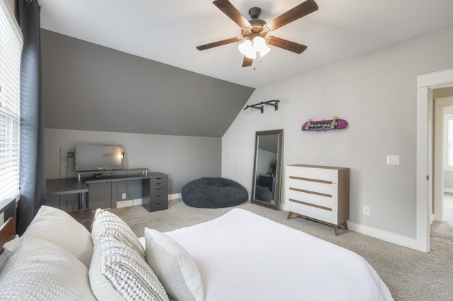 carpeted bedroom featuring lofted ceiling and ceiling fan