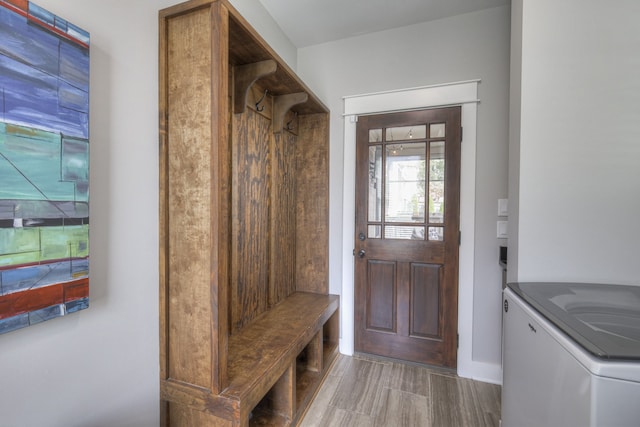 mudroom featuring washer / clothes dryer and dark wood-type flooring