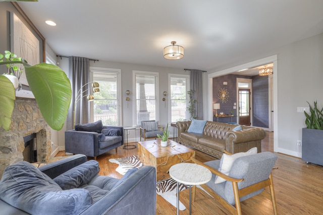 living room featuring hardwood / wood-style floors and a fireplace