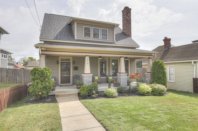 bungalow-style house featuring a porch and a front yard