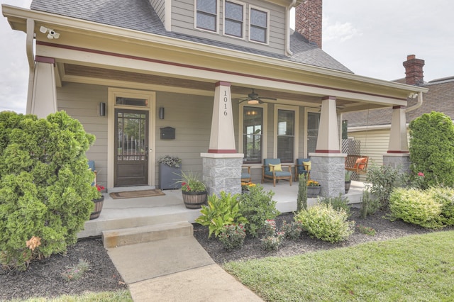 property entrance with ceiling fan and a porch