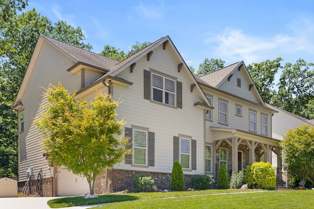 view of front of house featuring a garage and a front yard