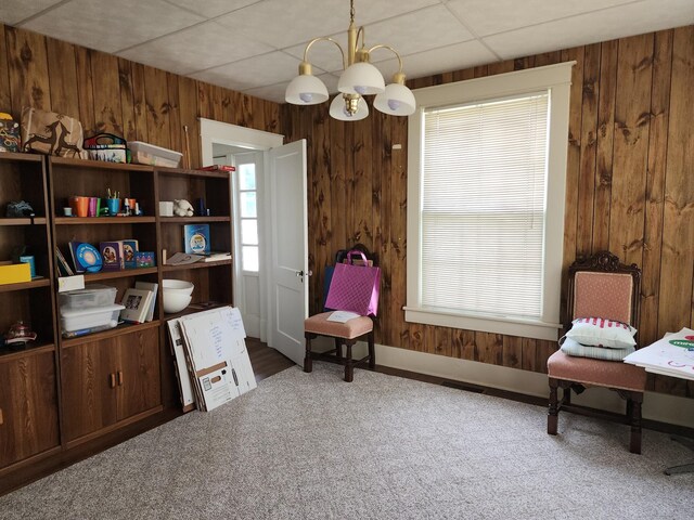 405 S Jackson St, Tullahoma, TN 37388 - sitting room featuring wooden walls, a notable chandelier, a drop ceiling, and carpet
