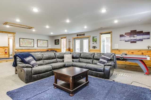 carpeted living room with french doors