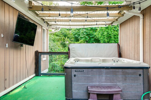 view of patio / terrace with a hot tub